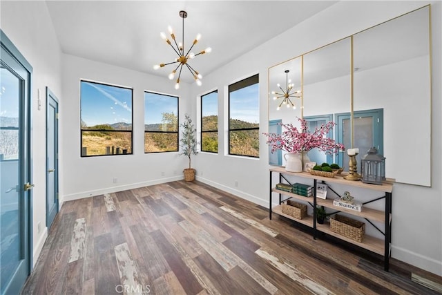 791 Cypress Rd, Lake Arrowhead, CA 92321 - empty room with a chandelier, wood finished floors, and baseboards