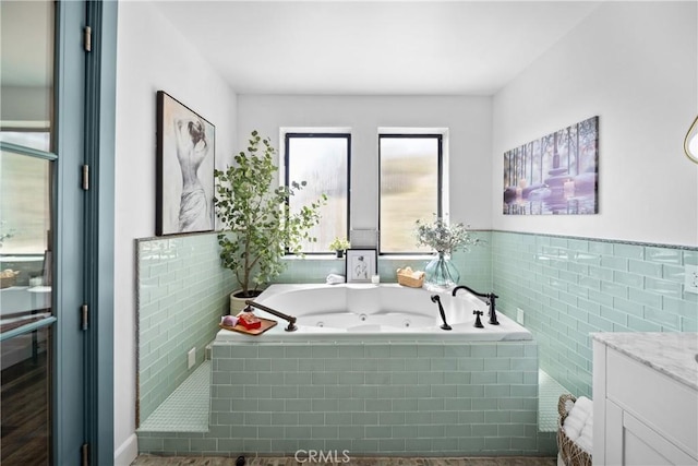791 Cypress Rd, Cedar Glen, CA 92321 - full bath featuring a tub with jets, vanity, tile walls, and wainscoting