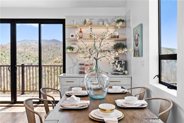 791 Cypress Rd, Lake Arrowhead, CA 92321 - dining space with wood finished floors and a mountain view