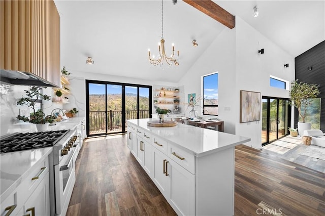 791 Cypress Rd, Lake Arrowhead, CA 92321 - kitchen with stainless steel stove, high vaulted ceiling, a chandelier, dark wood-style flooring, and beam ceiling