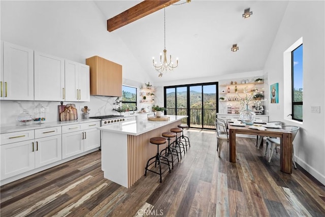 791 Cypress Rd, Lake Arrowhead, CA 92321 - kitchen with high vaulted ceiling, dark wood-style floors, a chandelier, white cabinets, and light countertops