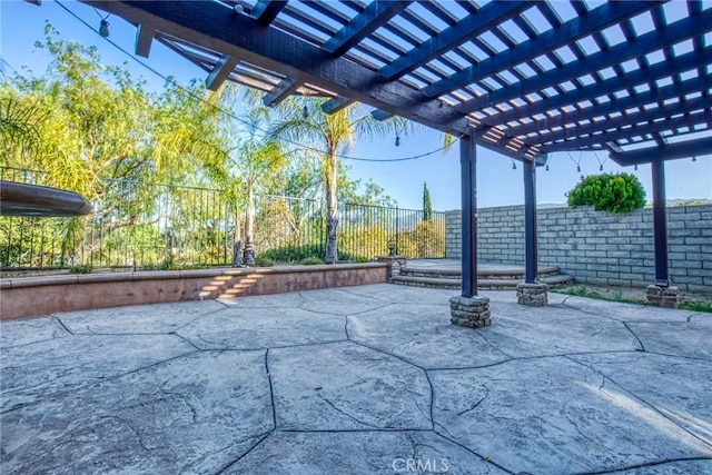 view of patio with a fenced backyard and a pergola