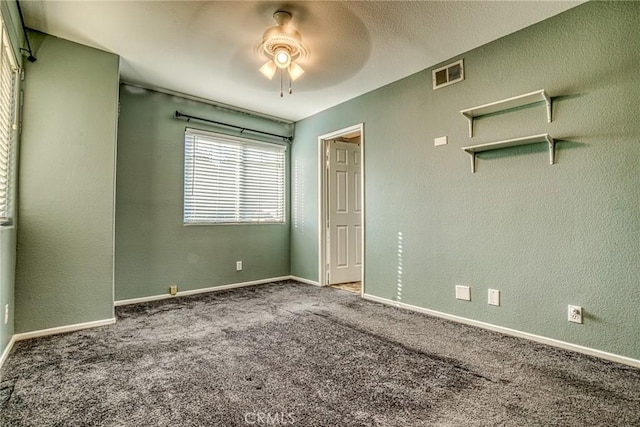 unfurnished bedroom featuring carpet, ceiling fan, and baseboards