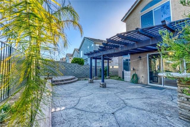 view of patio featuring a pergola and a fenced backyard