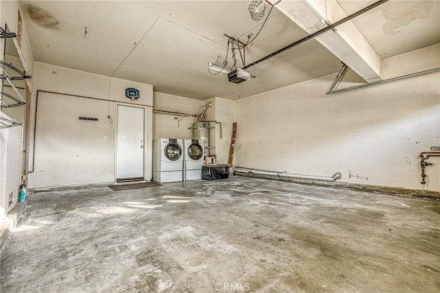 garage featuring separate washer and dryer, a garage door opener, and water heater