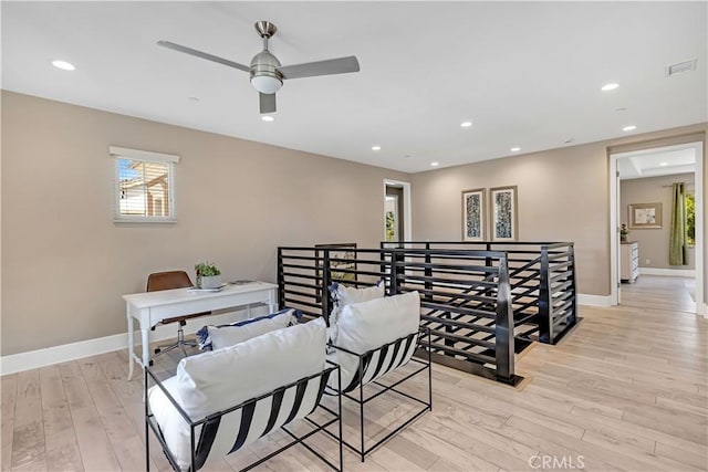 home office featuring light wood-type flooring, ceiling fan, baseboards, and recessed lighting