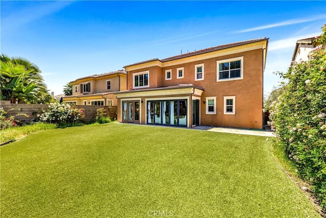 rear view of property featuring stucco siding