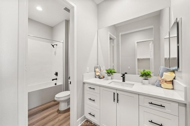 6533 Canyon Oaks Dr, Simi Valley, CA 93063 - bathroom with toilet, vanity, wood finished floors, and shower / bathtub combination