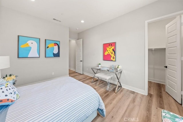 6533 Canyon Oaks Dr, Simi Valley, CA 93063 - bedroom featuring light wood-style flooring, baseboards, recessed lighting, and a walk in closet