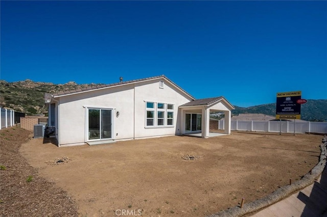 6533 Canyon Oaks Dr, Simi Valley, CA 93063 - back of property with central AC, fence, stucco siding, and a patio area