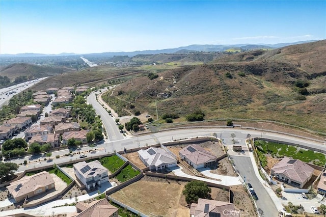 6533 Canyon Oaks Dr, Simi Valley, CA 93063 - aerial overview of property's location with a mountainous background and nearby suburban area