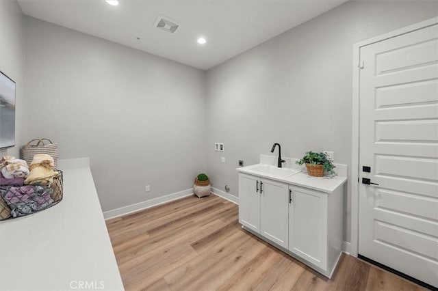 6533 Canyon Oaks Dr, Simi Valley, CA 93063 - washroom featuring hookup for an electric dryer, hookup for a washing machine, light wood-style floors, recessed lighting, and baseboards