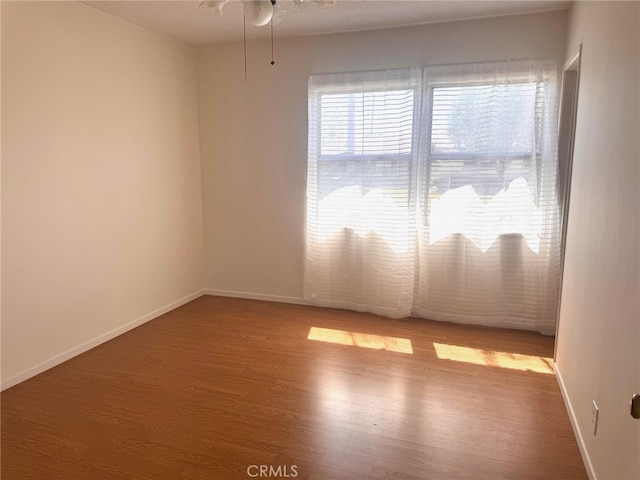 15602 Pitts Ave, Paramount, CA 90723 - empty room featuring wood finished floors, baseboards, and ceiling fan