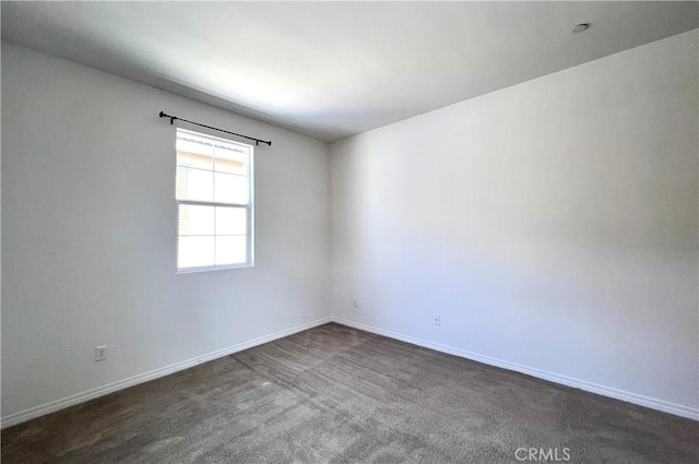 2873 S Via Belamaria, Ontario, CA 91762 - spare room featuring baseboards and dark carpet