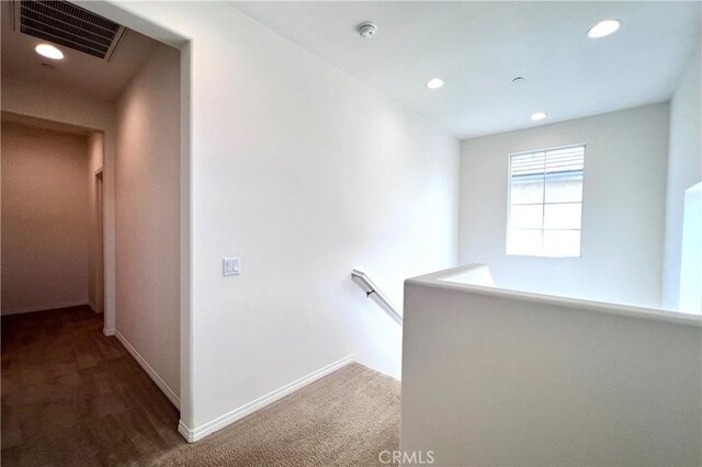 2873 S Via Belamaria, Ontario, CA 91762 - corridor with carpet floors, an upstairs landing, baseboards, and recessed lighting