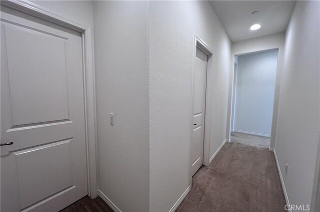 2873 S Via Belamaria, Ontario, CA 91762 - corridor featuring baseboards and dark carpet