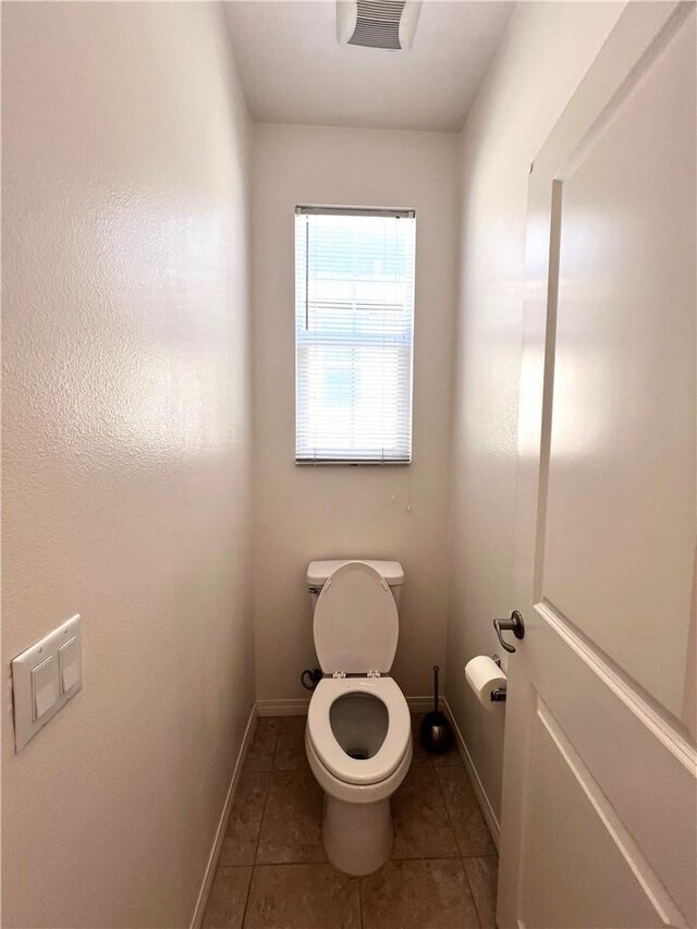 2873 S Via Belamaria, Ontario, CA 91762 - bathroom featuring toilet, tile patterned floors, and baseboards