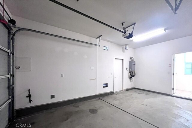 2873 S Via Belamaria, Ontario, CA 91762 - garage with a garage door opener and baseboards