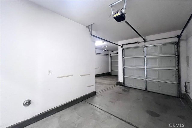 2873 S Via Belamaria, Ontario, CA 91762 - garage with baseboards and a garage door opener