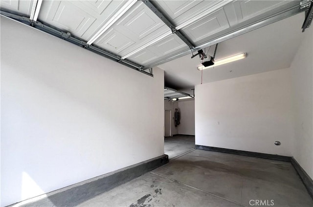 2873 S Via Belamaria, Ontario, CA 91762 - garage with baseboards and a garage door opener