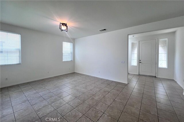 2873 S Via Belamaria, Ontario, CA 91762 - empty room featuring tile patterned floors and baseboards