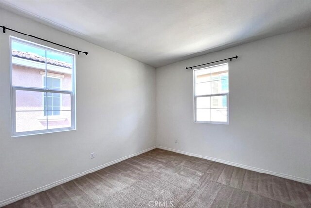2873 S Via Belamaria, Ontario, CA 91762 - spare room featuring baseboards and carpet flooring