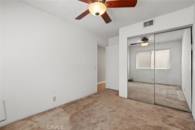20081 Winfield Ct Unit 2, Yorba Linda, CA 92886 - unfurnished bedroom with carpet, a textured ceiling, a closet, and ceiling fan