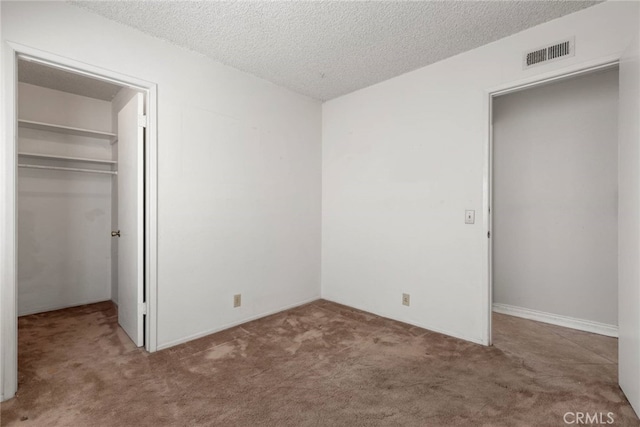 20081 Winfield Ct Unit 2, Yorba Linda, CA 92886 - unfurnished bedroom featuring a spacious closet, carpet flooring, a closet, and a textured ceiling