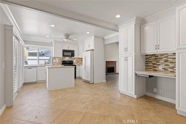 20081 Winfield Ct Unit 2, Yorba Linda, CA 92886 - kitchen featuring black appliances, a brick fireplace, a ceiling fan, tasteful backsplash, and light countertops