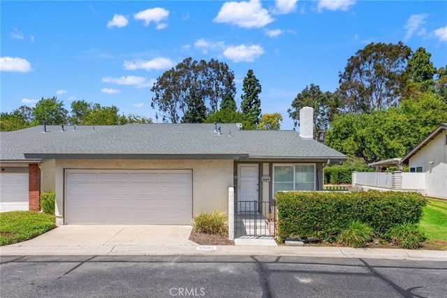 20081 Winfield Ct Unit 2, Yorba Linda, CA 92886 - view of front facade featuring driveway, an attached garage, a chimney, stucco siding, and fence