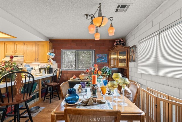 32923 Tindall Ave, Acton, CA 93510 - dining space with a textured ceiling and light wood-style flooring