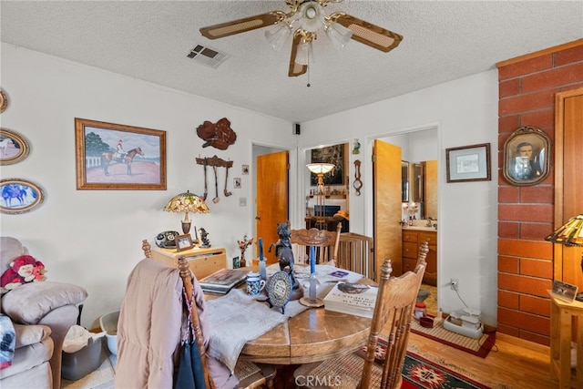 32923 Tindall Ave, Acton, CA 93510 - dining space with ceiling fan, a textured ceiling, and wood finished floors