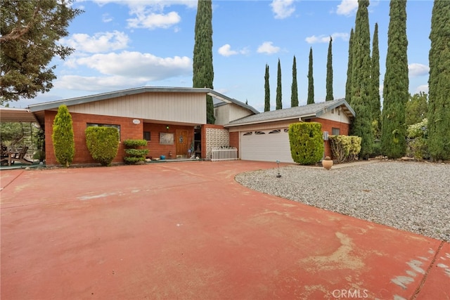32923 Tindall Ave, Acton, CA 93510 - view of front of property featuring driveway, an attached garage, and brick siding