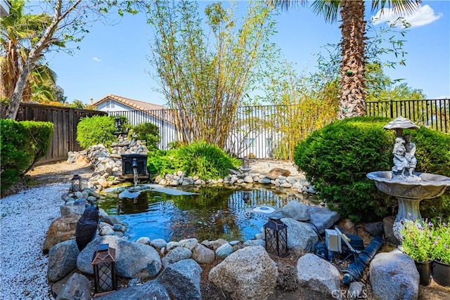 15108 Lighthouse Ln, Lake Elsinore, CA 92530 - fenced backyard with a small pond