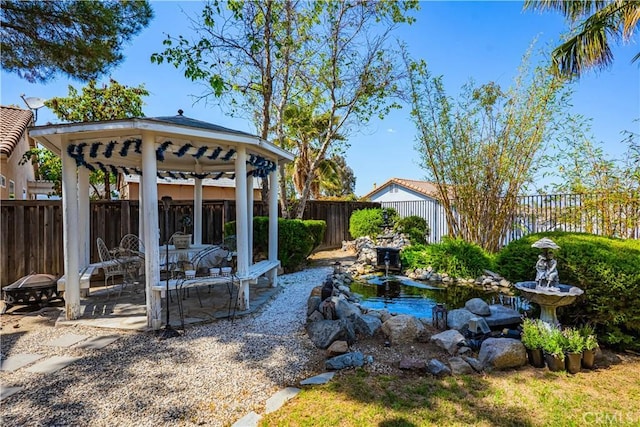 15108 Lighthouse Ln, Lake Elsinore, CA 92530 - fenced backyard featuring a gazebo, a garden pond, and a patio