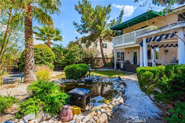 15108 Lighthouse Ln, Lake Elsinore, CA 92530 - view of yard with a balcony and fence