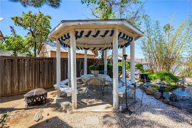 15108 Lighthouse Ln, Lake Elsinore, CA 92530 - view of patio / terrace with an outdoor fire pit, a gazebo, and a fenced backyard