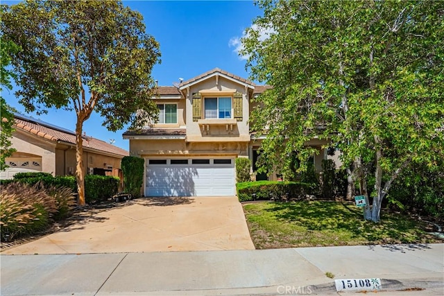 15108 Lighthouse Ln, Lake Elsinore, CA 92530 - view of front of property featuring an attached garage, stucco siding, driveway, a front lawn, and a tile roof
