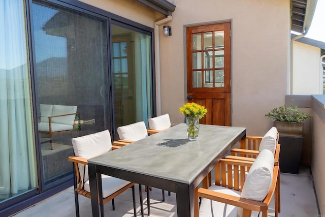 balcony with outdoor dining area