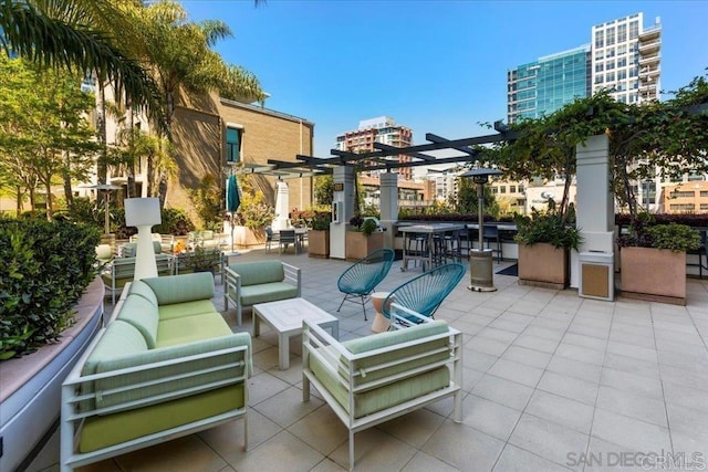 view of patio / terrace featuring a pergola and an outdoor hangout area