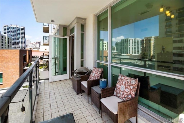 balcony featuring a city view