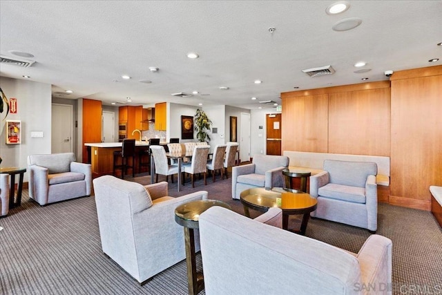 carpeted living room featuring recessed lighting