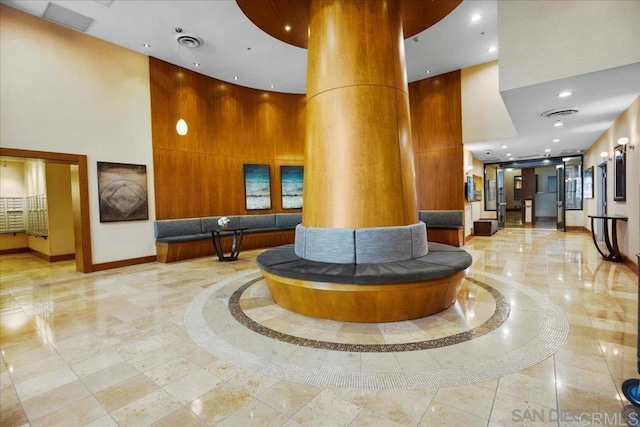 building lobby with a high ceiling and recessed lighting