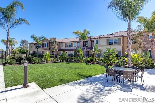 surrounding community featuring a patio area, a residential view, and outdoor dining area