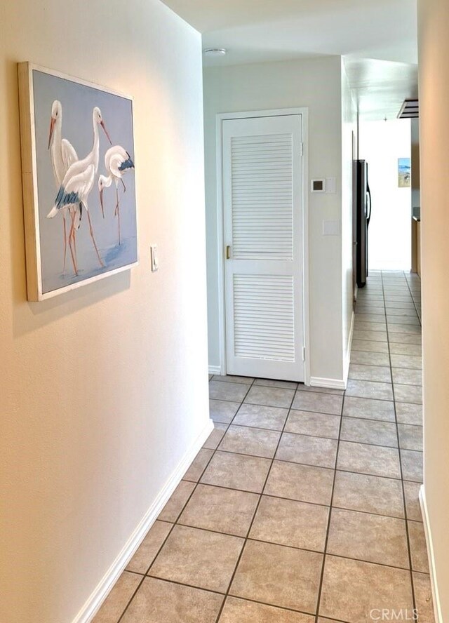 1310 E Ocean Blvd E Unit 1001, Long Beach, CA 90802 - hallway featuring light tile patterned floors and baseboards