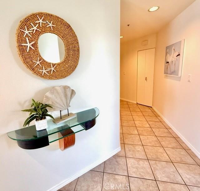 1310 E Ocean Blvd E Unit 1001, Long Beach, CA 90802 - hallway with light tile patterned floors, baseboards, and recessed lighting