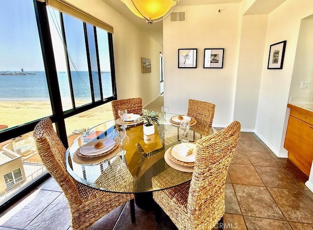1310 E Ocean Blvd E Unit 1001, Long Beach, CA 90802 - dining room featuring plenty of natural light, baseboards, and a water view