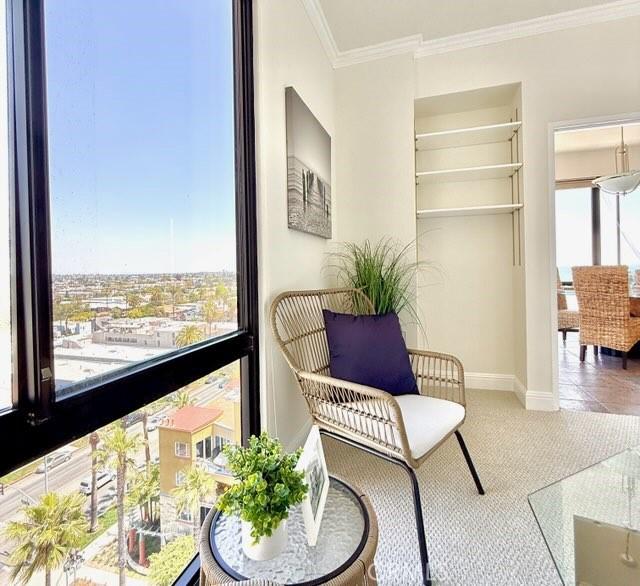 1310 E Ocean Blvd E Unit 1001, Long Beach, CA 90802 - sitting room featuring baseboards and crown molding