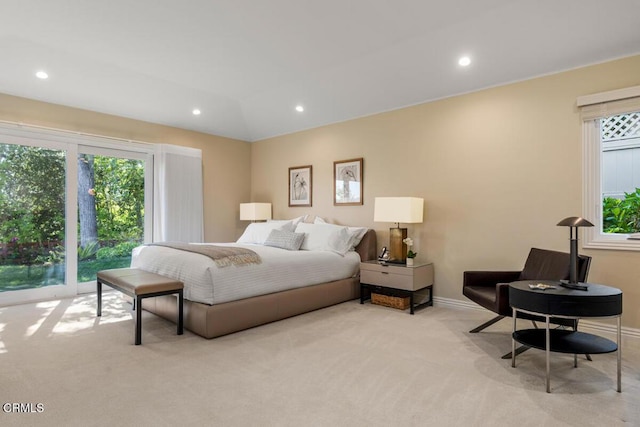 bedroom with light carpet, recessed lighting, and baseboards