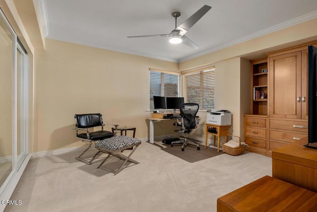 office area with carpet flooring, ornamental molding, ceiling fan, and baseboards